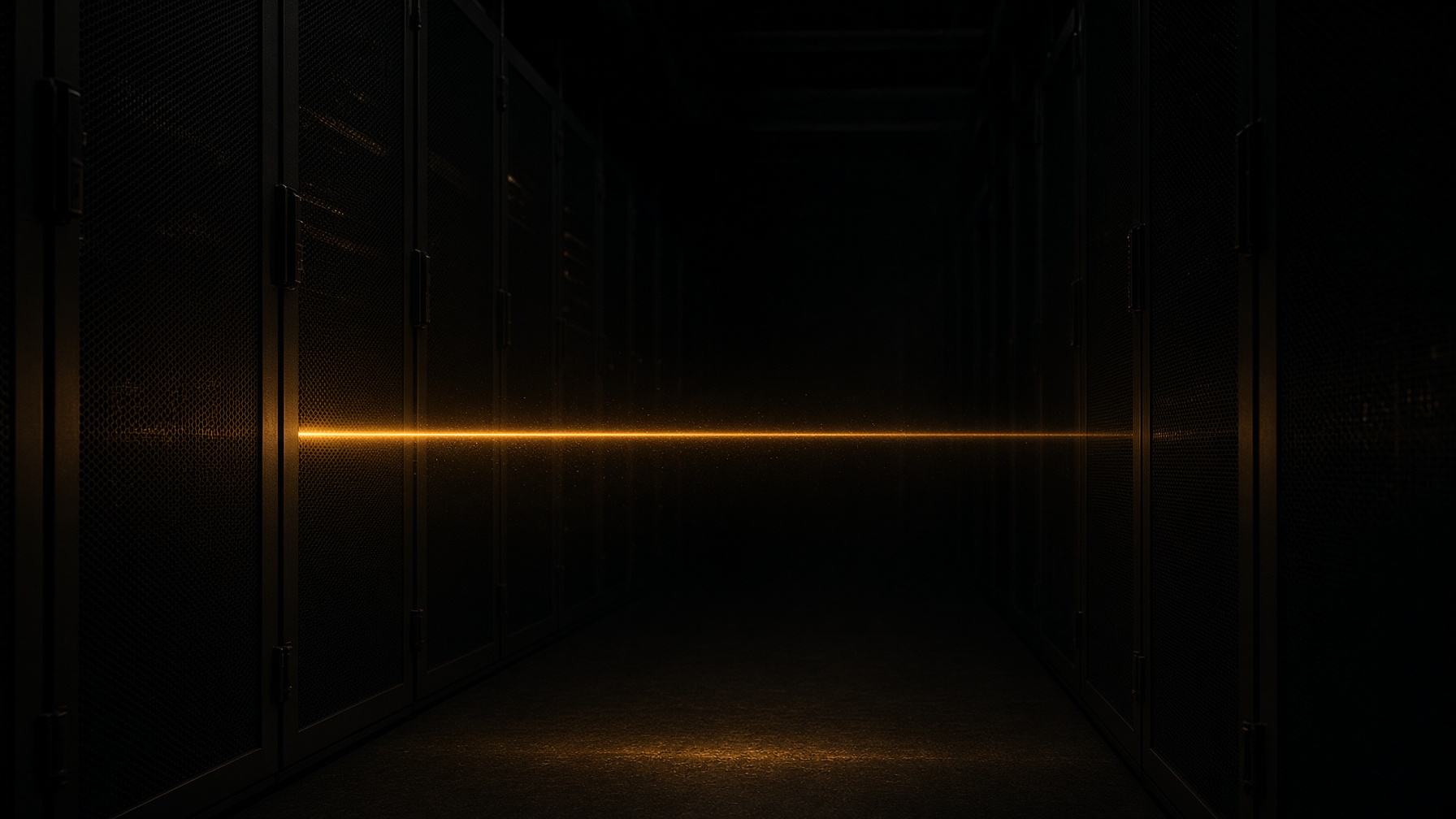 A single amber beam crossing a dark aisle of racks